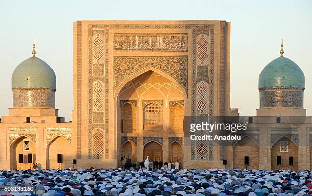 Muslims arrive at Khazrati Imam Complex to perform the Eid Al-Adha prayer in Tashkent, Uzbekistan on September 12, 2016. Muslims worldwide celebrate...