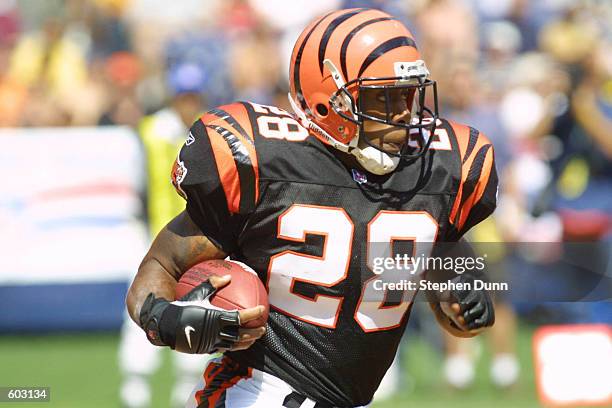 Corey Dillon of the Bengals runs with the ball against the Chargers in their game at Qualcomm Stadium in San Diego, California. The Chargers won...