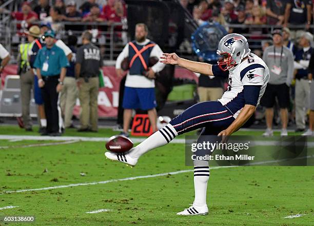 Punter Ryan Allen of the New England Patriots punts the ball to the Arizona Cardinals during the NFL game at University of Phoenix Stadium on...