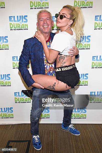 Elvis Duran and Lady Gaga pose during her visit to "The Elvis Duran Z100 Morning Show" at Z100 Studio on September 12, 2016 in New York City.