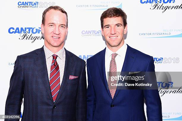 Former NFL player Peyton Manning and NY Giants, NFL player Eli Manning attend the Annual Charity Day hosted by Cantor Fitzgerald, BGC and GFI at...