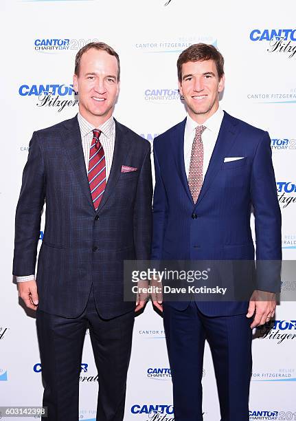 Former NFL player Peyton Manning and NY Giants, NFL player Eli Manning attend the Annual Charity Day hosted by Cantor Fitzgerald, BGC and GFI at...