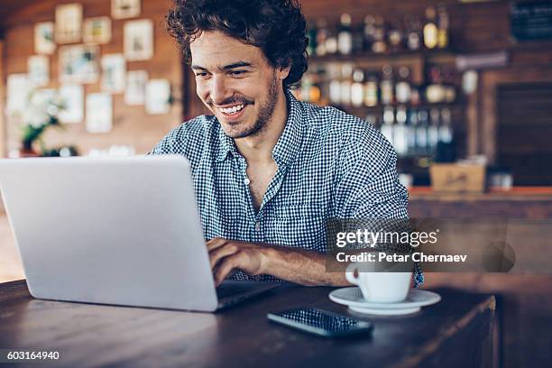 surfing the net in the cafeteria - person surfing the internet stock pictures, royalty-free photos & images