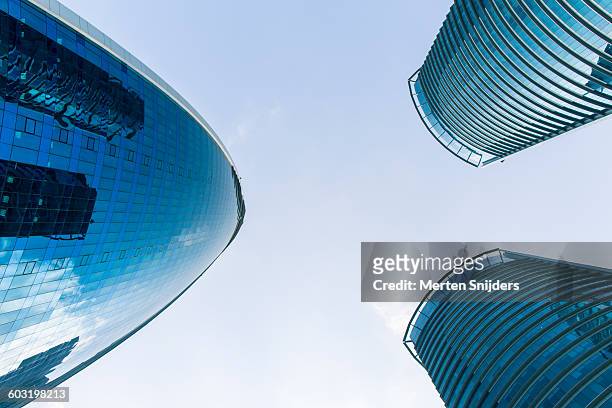 looking up to woqod tower - doha buildings stock pictures, royalty-free photos & images