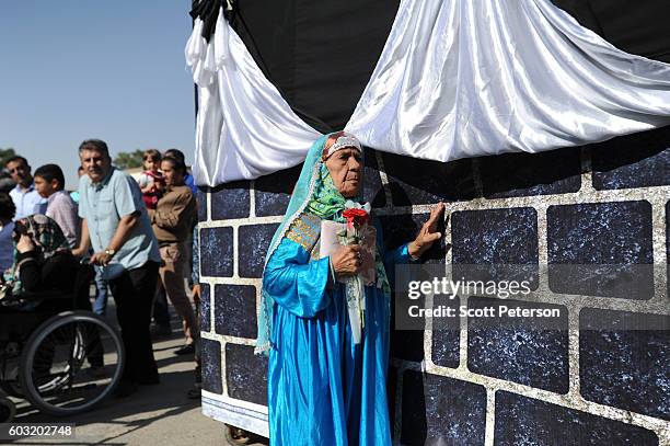 Iranian woman circles a makeshift Kaaba to reenact part of the Hajj pilgrimage, as Iranians marked the Eid Al-Adha Islamic "Feast of the Sacrifice"...