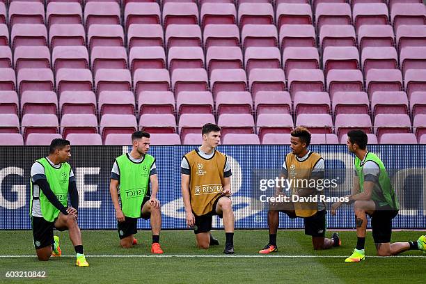 Celtic FC players warm up during a training session ahead of the UEFA Champions League Group C match against FC Barcelona at Camp Nou on September...