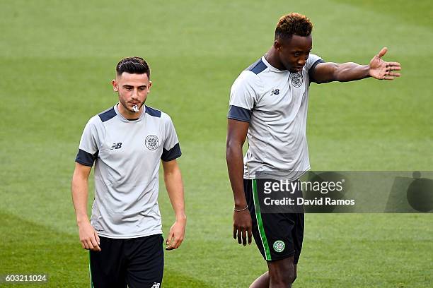 Patrick Roberts and Moussa Dembele of Celtic FC look on during a training session ahead of the UEFA Champions League Group C match against FC...
