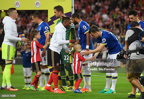 Young Sunderland mascot Bradley Lowery shakes hands with Everton player Seamus Coleman prior to the Premier League match between Sunderland and...