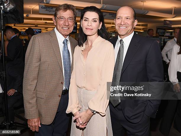 Joe Namath, Julianna Margulies, and Howard W. Lutnick attend the Annual Charity Day hosted by Cantor Fitzgerald, BGC and GFI at Cantor Fitzgerald on...