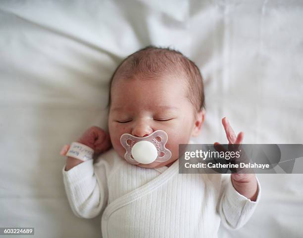 a newborn at the maternity ward - pacifier stockfoto's en -beelden