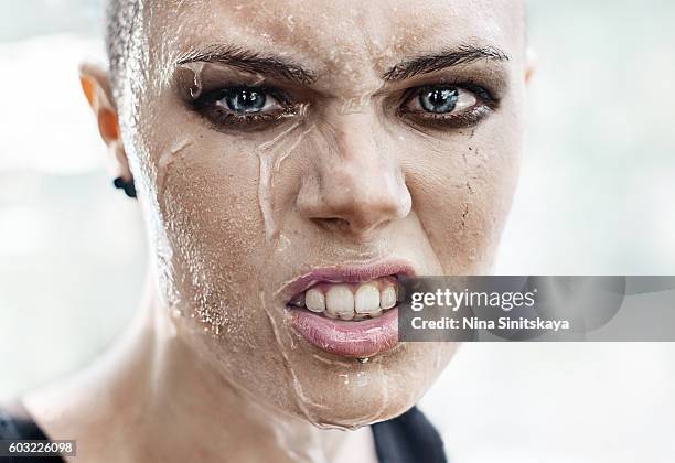 face shot of angry woman crying under the rain - smokey eyeshadow stock pictures, royalty-free photos & images