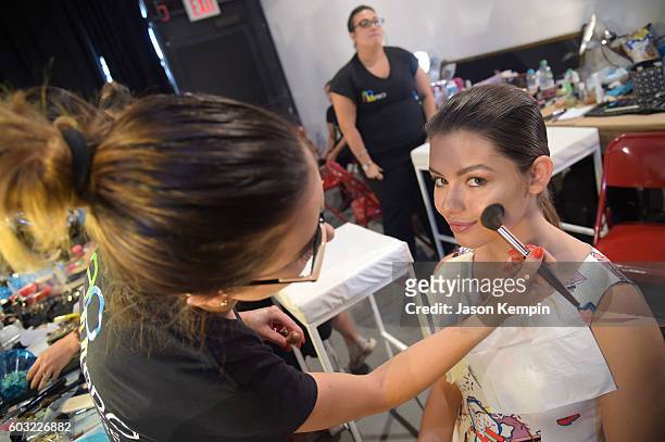 Fatima Ptacek gets her make-up done backstage at the Lu Yang By Yang Lu fashion show during New York Fashion Week: The Shows at Art Beam on September...