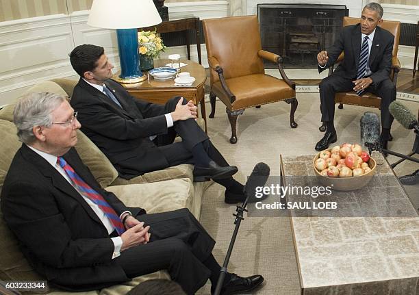 President Barack Obama speaks alongside Speaker of the House Paul Ryan and Senate Majority Leader Mitch McConnell , during a meeting with...