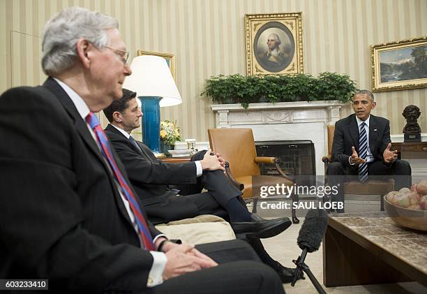 President Barack Obama speaks alongside Speaker of the House Paul Ryan and Senate Majority Leader Mitch McConnell , during a meeting with...