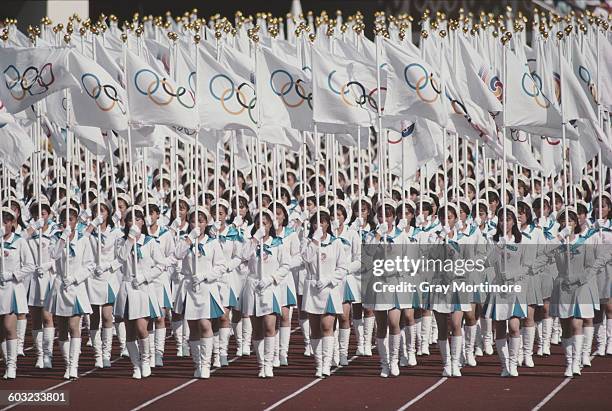 The Olympic Flag is presented in the Olympic Stadium during the Opening Ceremony of the XXIV Summer Olympic Games on 17 September 1988 at the Seoul...