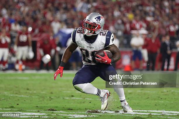 Running back James White of the New England Patriots runs with the football against the Arizona Cardinals during the NFL game at the University of...