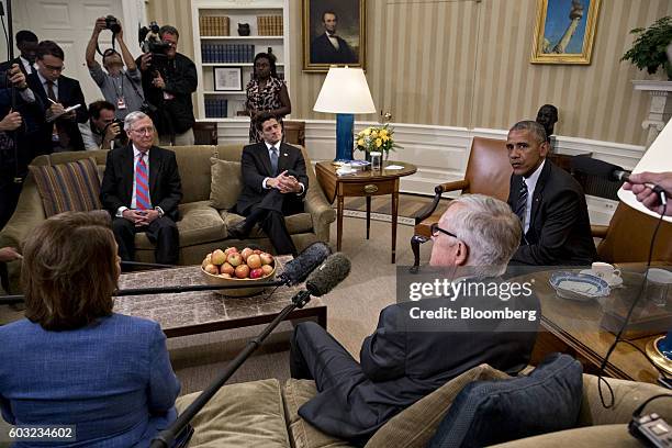 President Barack Obama, right, speaks as Senate Majority Leader Mitch McConnell, a Republican from Kentucky, from left, U.S. House Speaker Paul Ryan,...