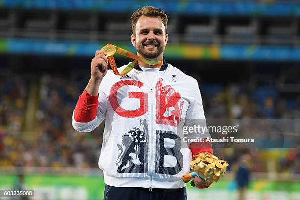 Gold medalist Aled Davies of Great Britain celebrates on the podium at the medal ceremony for the Men's Shot Put - F42 on day 5 of the Rio 2016...