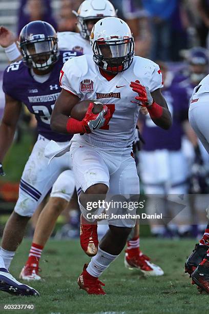 George Moreira of the Illinois State Redbirds runs for a first down on the final drive of the game against the Northwestern Wildcats at Ryan Field on...