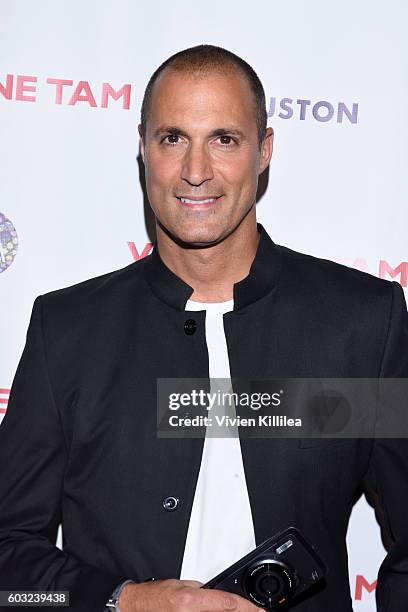 Nigel Barker poses backstage at the Vivienne Tam fashion show during New York Fashion Week: The Shows at The Arc, Skylight at Moynihan Station on...