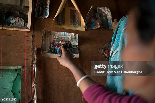 Cheten Tamang of Thyangsyap village points at a photo of her son who died together with 8 other relatives when an avalanche of ice and rocks,...