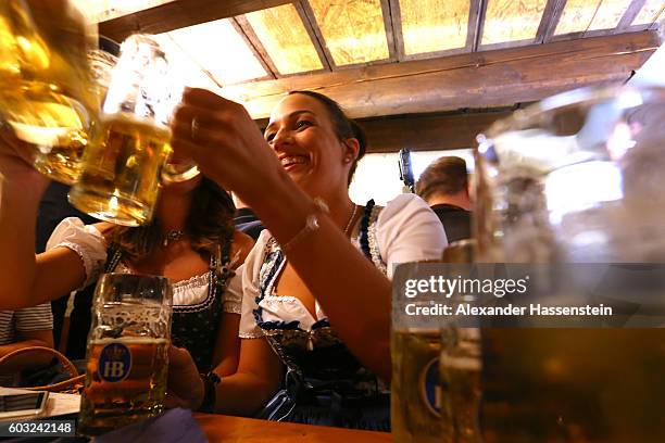 Women dressed in traditional Bavarian clothing Dirndl attend the annual beer tasting prior to the2016 Oktoberfest in the cellar of the Munich Beer...