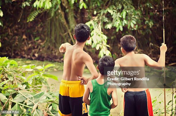 young boys by the river - luisiana photos et images de collection