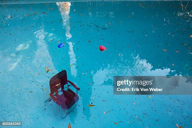 lawn chair sunk to bottom of pool after party - leftover stock pictures, royalty-free photos & images