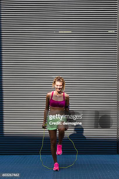 Jump Roping Woman Woman In Sportswear Doing Workout With Jumping Rope High-Res Stock ...