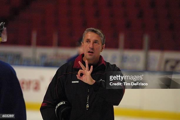 Head Coach Bob Hartley of the Colorado Avalanche gives his club direction during a training camp session during the 2001 NHL Challenge Series at the...