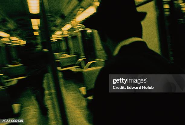 man chasing person on train - chasing train stock pictures, royalty-free photos & images
