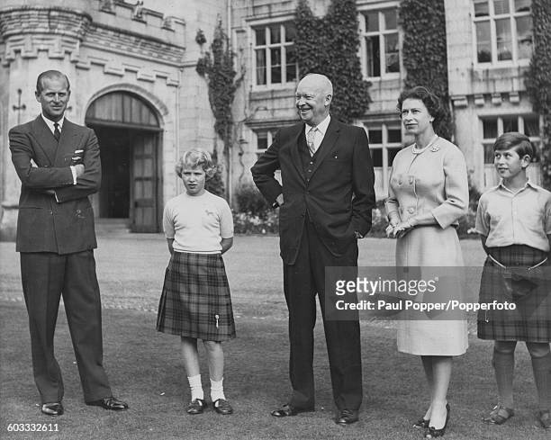 Queen Elizabeth II and her family; Prince Philip, Duke of Edinburgh, Princess Anne and Prince Charles, standing with President of the United States,...