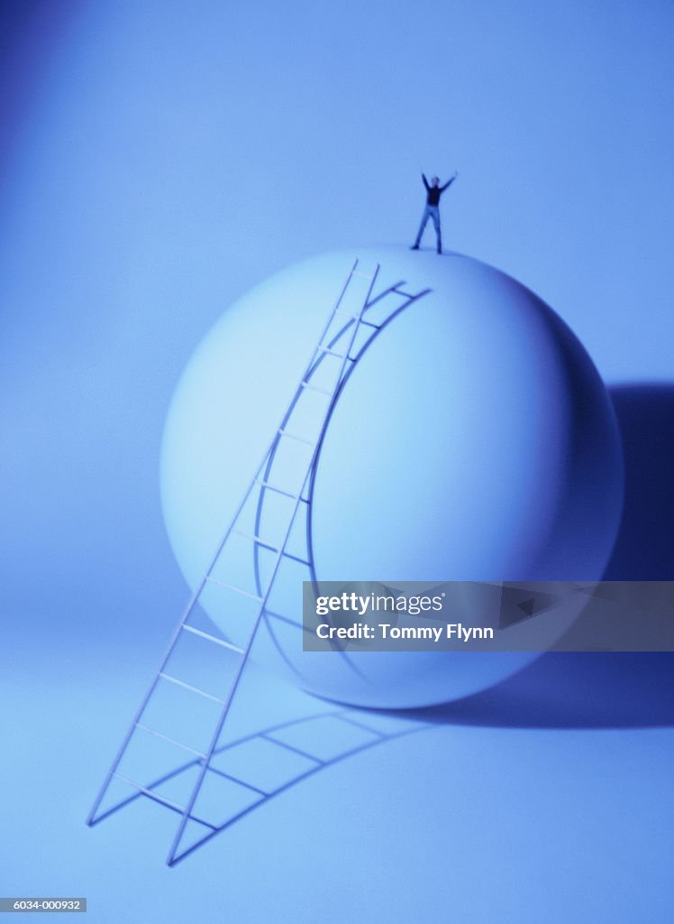 Person Standing on Sphere