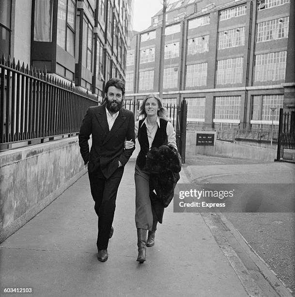 English musician and singer Paul McCartney of the Beatles and his wife Linda outside the Royal Courts of Justice in London, UK, 19th February 1971....