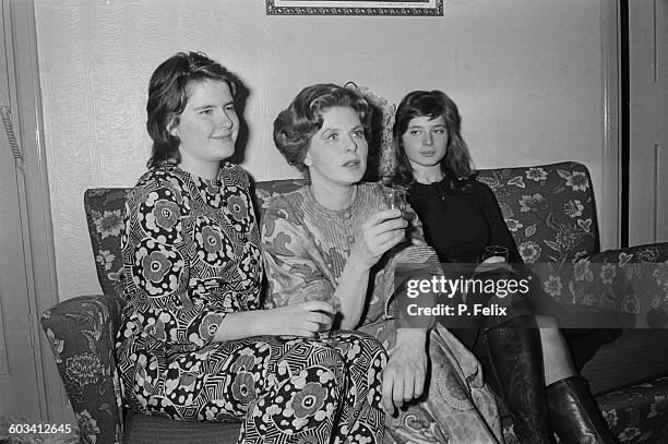 Swedish film and theatre actress Ingrid Bergman sits with her twin daughters, actress Isabella and academic Isotta Ingrid after Bergman's performance...