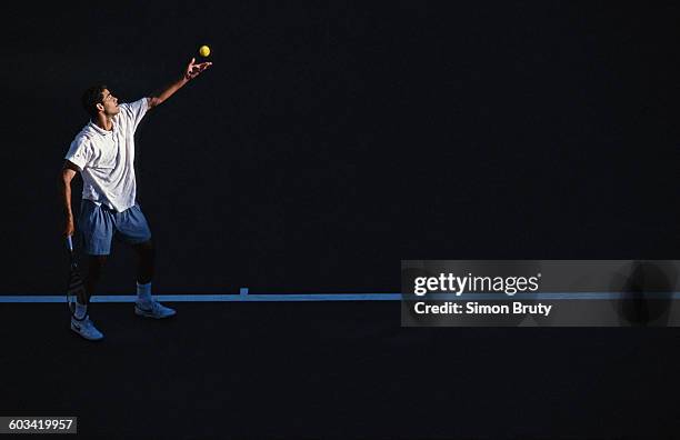 Pete Sampras of the United States serves to Andre Agassi during their Men's Singles Final match of the United States Open Tennis Championship on 10...