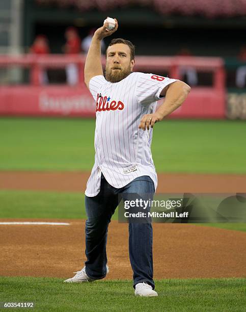 Wrestler Daniel Bryan throws out the first pitch prior to the game between the Pittsburgh Pirates and Philadelphia Phillies at Citizens Bank Park on...