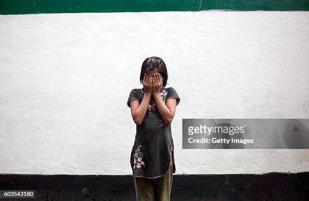 Year old Gitanjali poses for a photo on August 1, 2016 in Uttar Pradesh, India. Her 30 year old father sexually abused her for years and raped her...