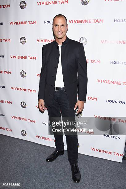 Nigel Barker poses backstage at the Vivienne Tam fashion show during New York Fashion Week: The Shows at The Arc, Skylight at Moynihan Station on...