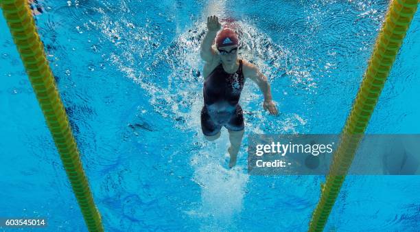 Ellie Simmonds of the UK wins the gold medal in world record time in the women's 200m IM - SM6 final at the Olympic Aquatics Stadium during the...