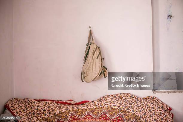 Year old Sadaf's school bag hangs from her wall on September 8, 2016 in Uttar Pradesh, India. 3 months ago she was raped by a doctor in her village....