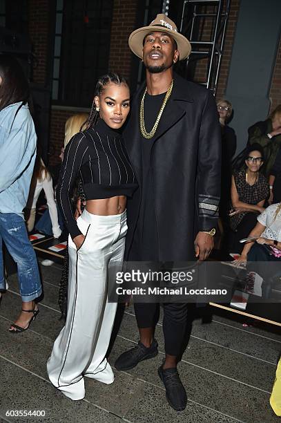 Professional Basketball Players Iman Shumpert and guest attend the DKNY Women fashion show during New York Fashion Week: The Shows September 2016 at...