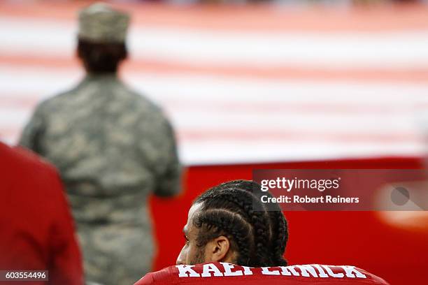 Colin Kaepernick of the San Francisco 49ers kneels in protest during the national anthem prior to playing the Los Angeles Rams in their NFL game at...