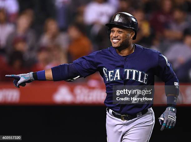 Robinson Cano of the Seattle Mariners celebrates his solo homerun to take a 2-0 lead over the Los Angeles Angels of Anaheim during the third inning...