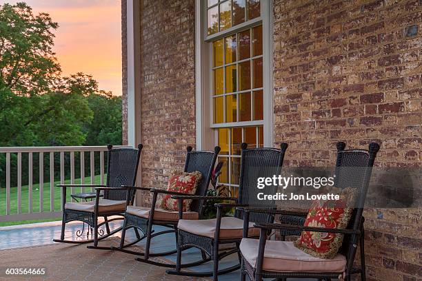 porch at sunset - inn stock pictures, royalty-free photos & images