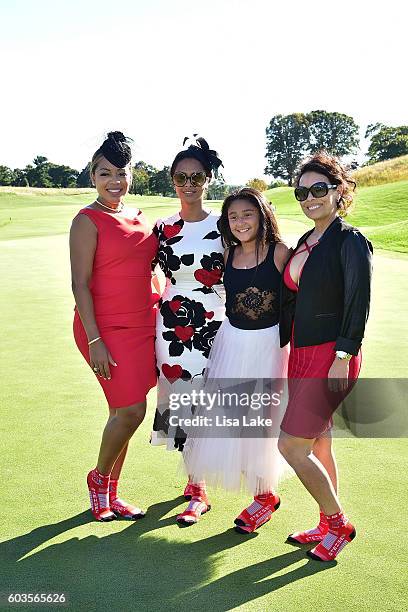 Lealani Shaw, Dorys and Julieta Erving, Ruth Garcia pose on the green at the Julius Erving Golf Classic Event at the ACE Club on September 12, 2016...