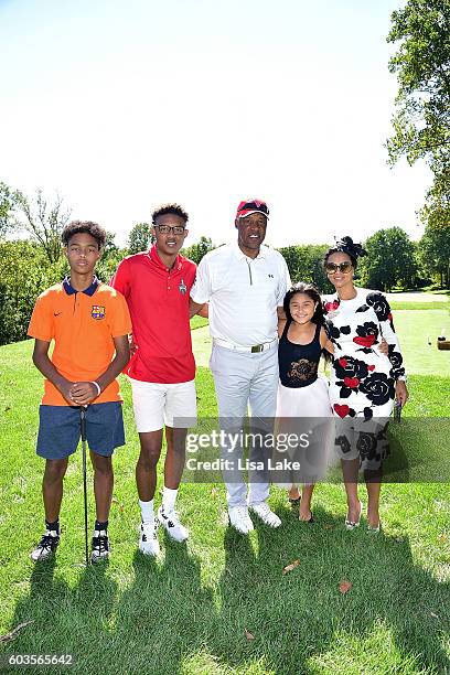 Jules Erving, Justin Erving, Julius Erving, Julieta Erving and Dorys Erving pose on the golf course during the Julius Erving Golf Classic Event at...