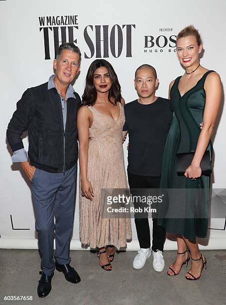 Stefano Tonchi, Priyanka Chopra, Jason Wu and Karlie Kloss attend the W Magazine and Hugo Boss Celebrate "The Shot" event at the International Center...