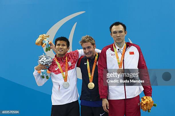 Silver medalist Keiichi Kimura of Japan, gold medalist Bradley Snyder of the United States and bronze medalist Bozun Yang of China celebrate on the...