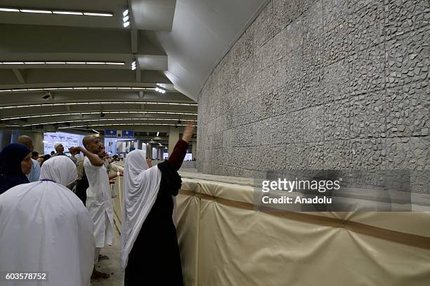 Muslim pilgrims perform stoning of the devil ritual during Hajj during the Eid al-Adha in the Mina district of Mecca, Saudi Arabia, on September 13,...